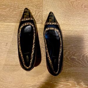 black / brown Fendi Low heels , worn down a bit , but still in great shape.